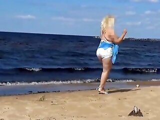 Hot Mom On The Beach In Milky Swimsuit